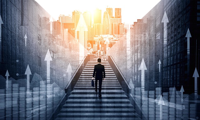 A person in business attire is walking up a wide staircase towards a bright, sunlit cityscape in the distance. The image features upward-pointing arrows and financial graphs, symbolizing progress, ambition, and the pursuit of success. The overall scene conveys a sense of determination and forward momentum.
